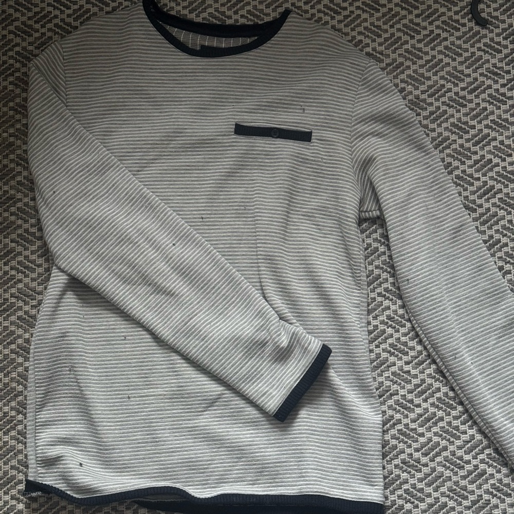 White and black striped long sleeve top.